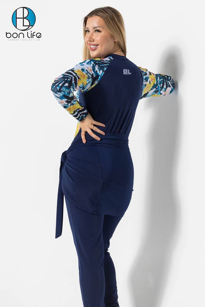 Woman wearing a navy blue outfit with colorful sleeves against a white background, featuring the 'bon life' brand.
