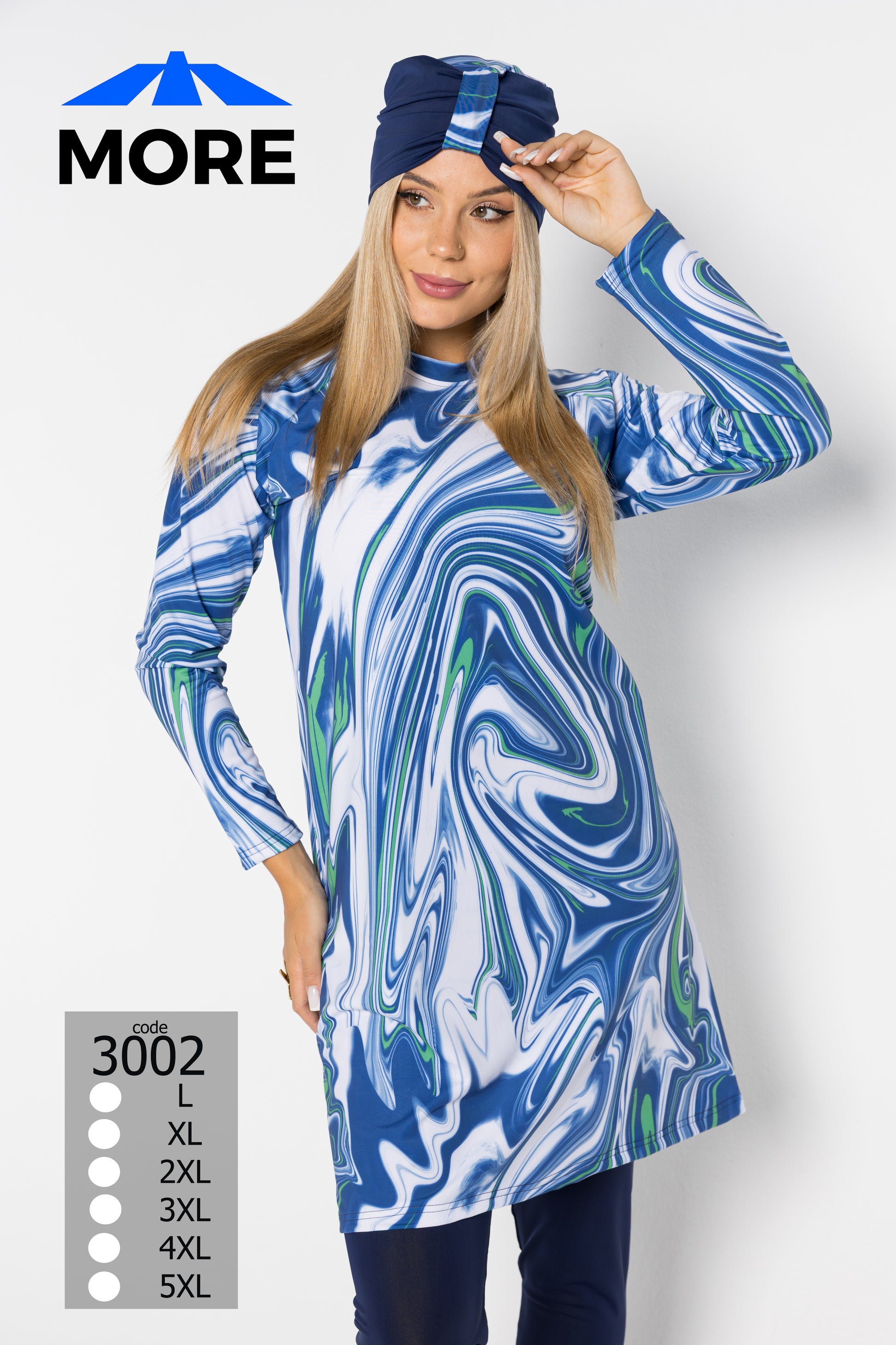 Woman wearing a blue and white marbled dress with a matching headscarf, on a white background.