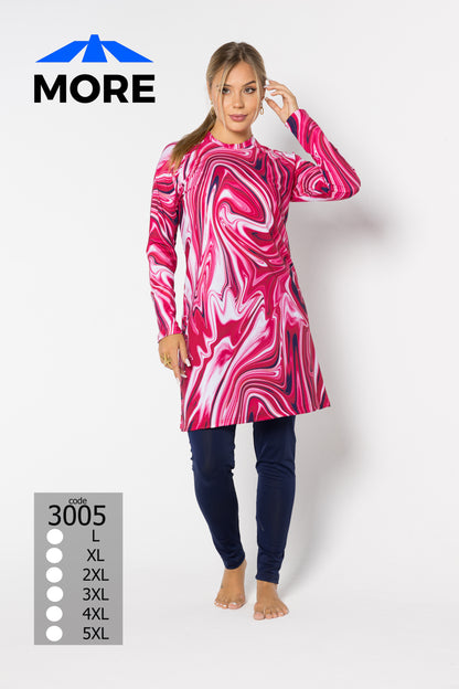 Woman wearing a pink and white marbled dress with navy leggings on a white background, featuring the brand 'MORE'.