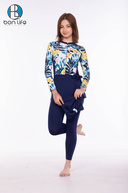 Woman wearing a colorful floral hoodie and navy leggings on a white background with 'bon life' branding.