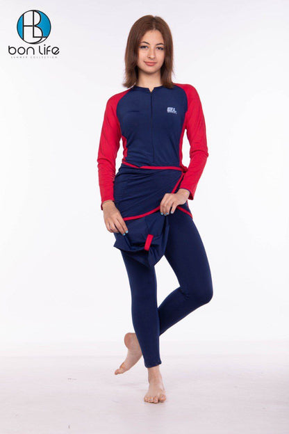 Woman wearing a navy and red swimsuit with 'bon life' branding on a white background