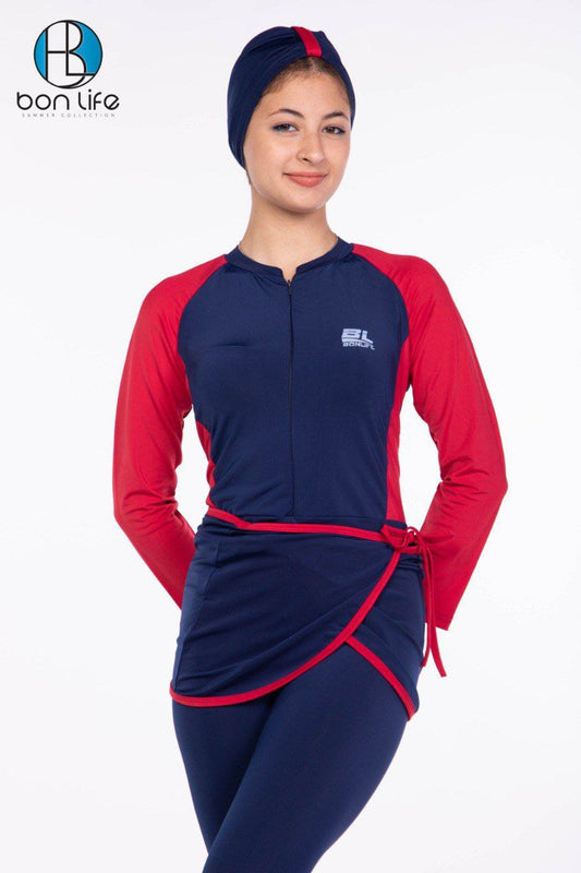Woman wearing a navy and red outfit with a brand logo on a white background